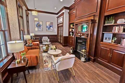 a living room filled with furniture and a fireplace